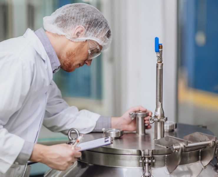 Scientist,Staff,Working,With,Equipment,In,Science,Lab.,Medical,Factory